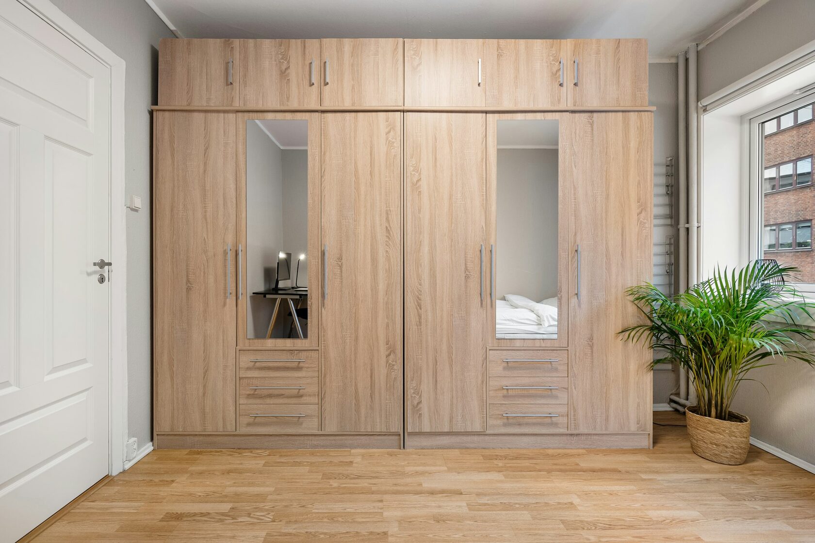 Fitted oak wardrobe with carefully aligned doors