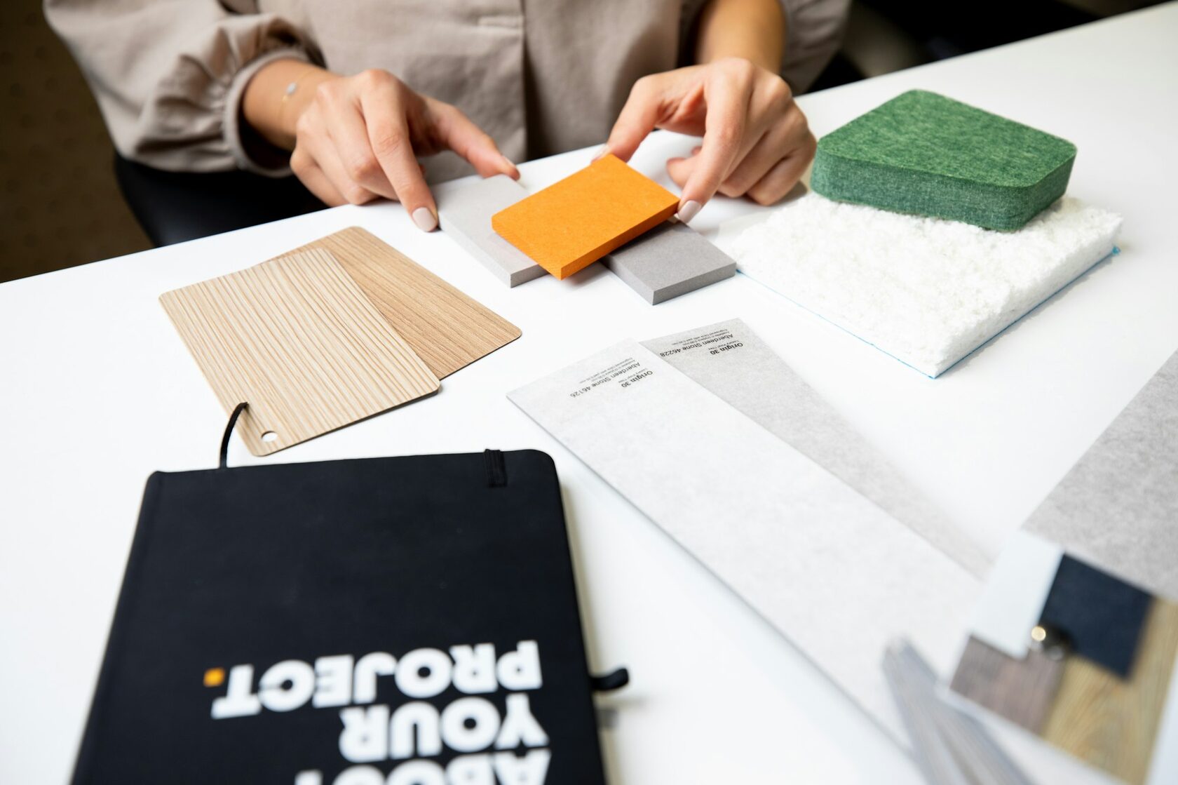 Design studio with timber material samples and joinery models